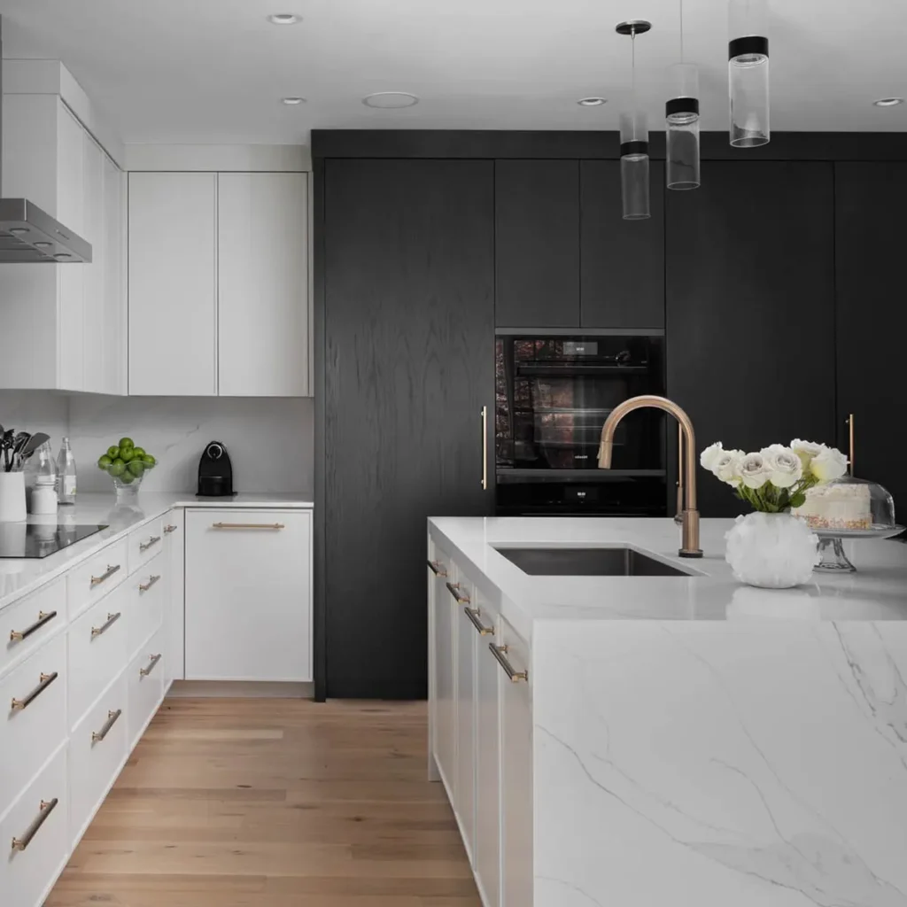 Modern kitchen with white counters and dark cabinets