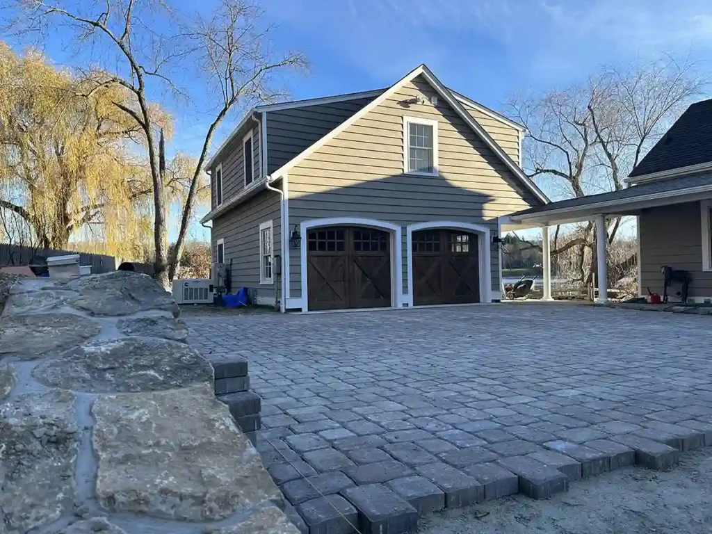 Custom stone work on driveway of suburban home