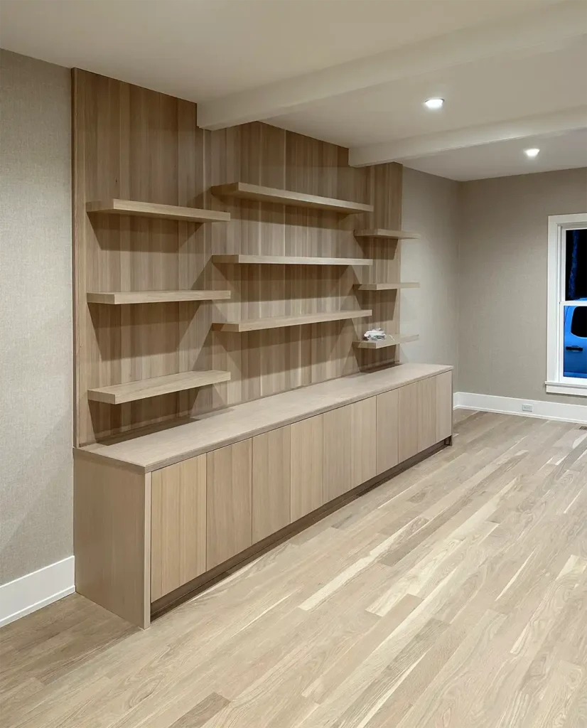 Custom carpentry of modern book shelves
